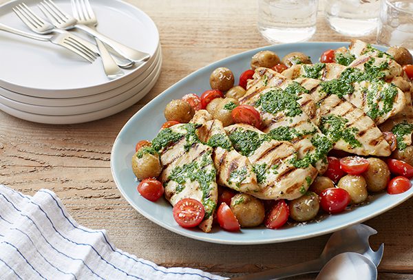 Italian Salsa Verde Grilled Chicken Cutlets with warm baby potato and cherry tomato salad