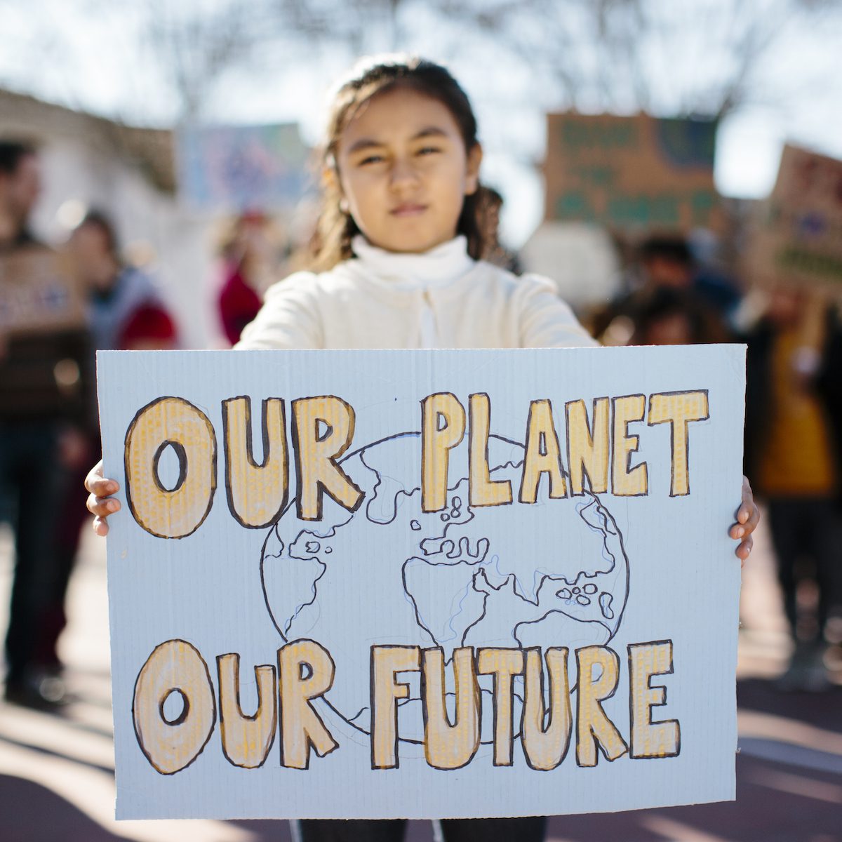 Young Girl Carrying A Banner